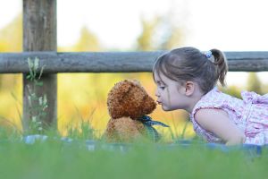 YOUNG GIRL AND BEAR